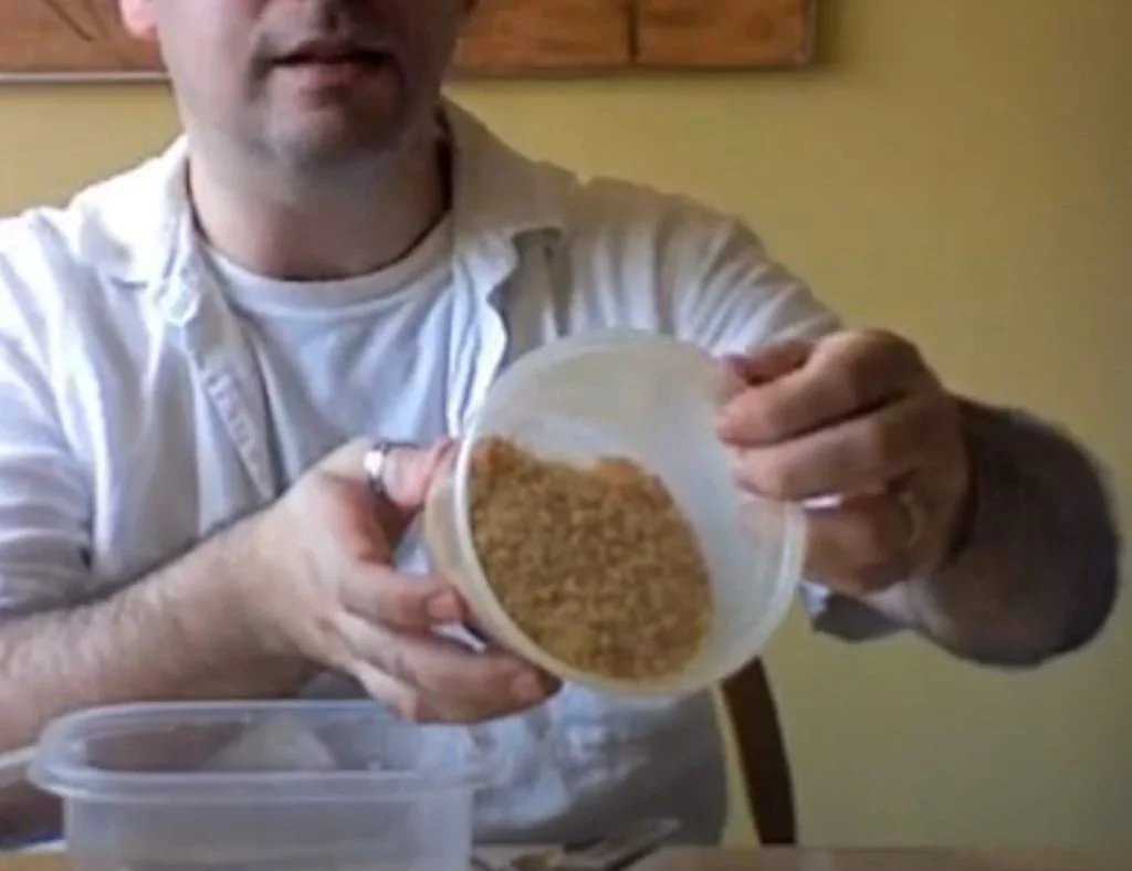 Dry rabbit skin glue granules, light brown flakes like coarse sand