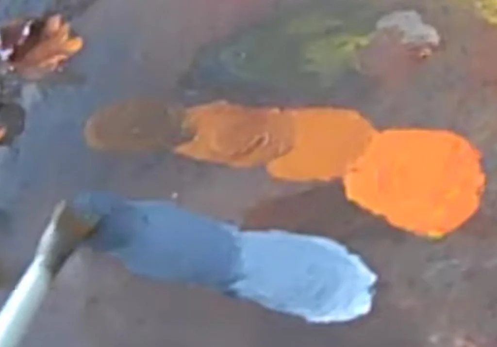 Grey swatches mixed to match the value of the orange
