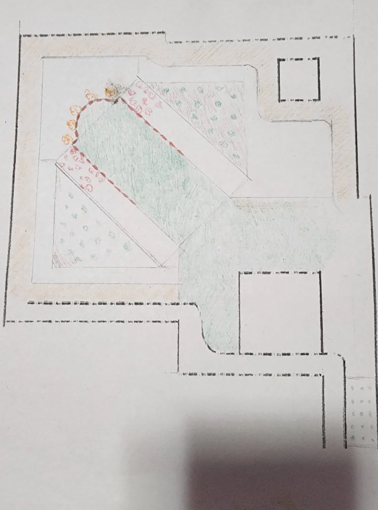 Hand-drawn garden layout sketch showing a center lawn path running diagonally from the patio to the back corner