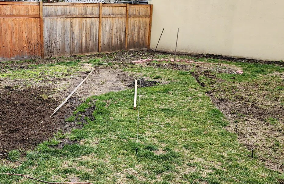 The re-aligned center path marked out with wooden boards and a taut string line